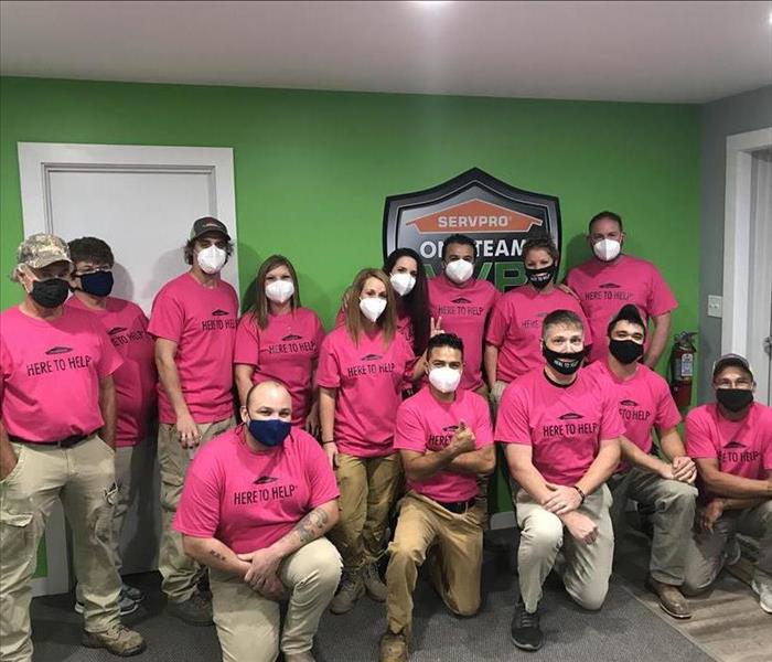 SERVPRO employees in pink t-shirts
